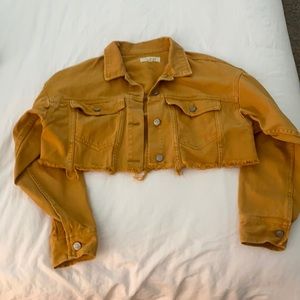 Mustard colored cropped frayed denim jacket